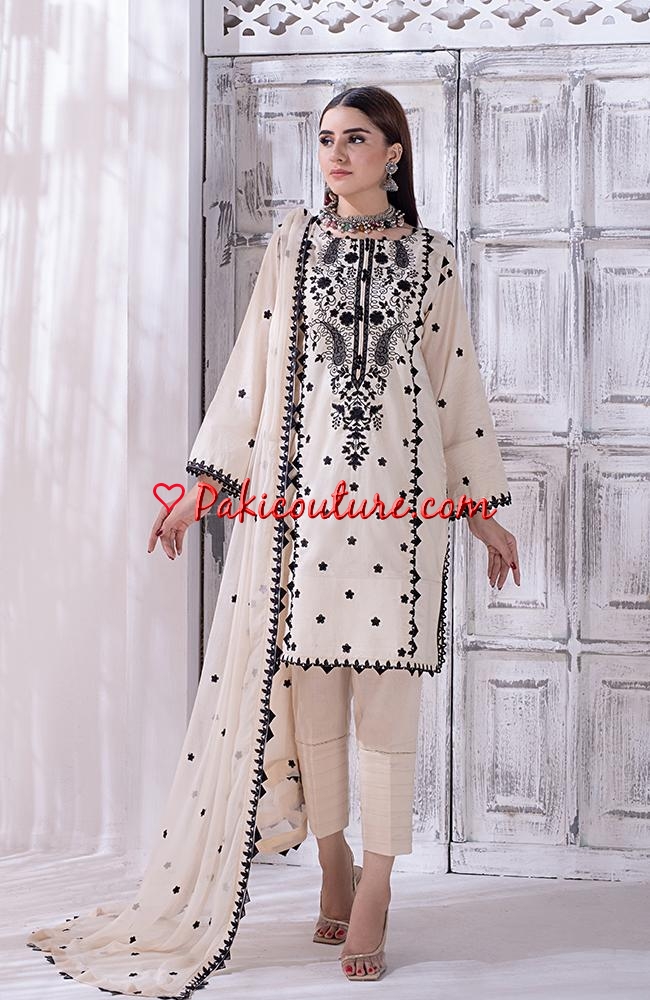 White and black embroidered dress hotsell